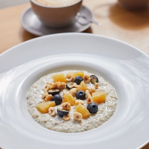 Oatmeal with Chia Seeds, Dried Peaches, Blueberries and Hazelnuts